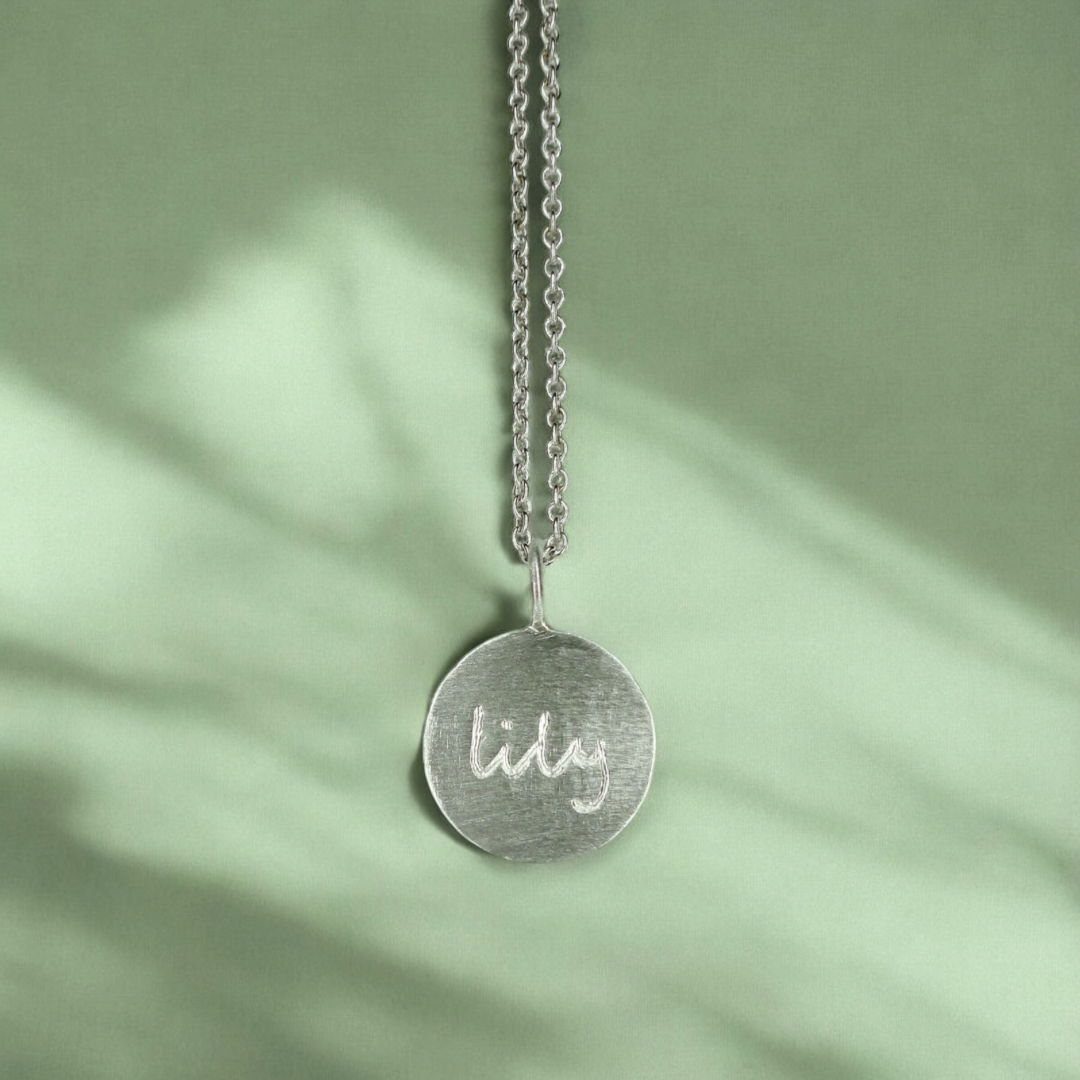 Custom engraved disc pendant necklace in sterling silver