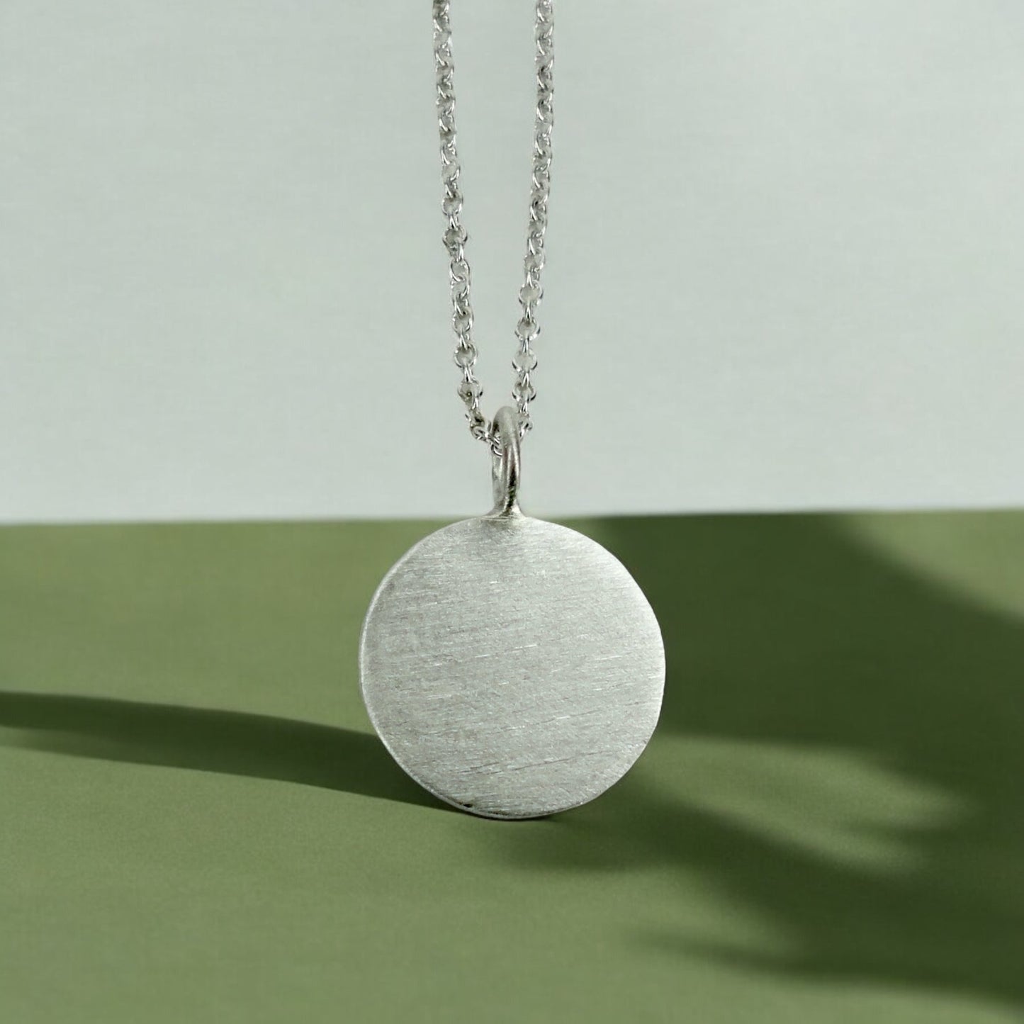Custom engraved disc pendant necklace in sterling silver