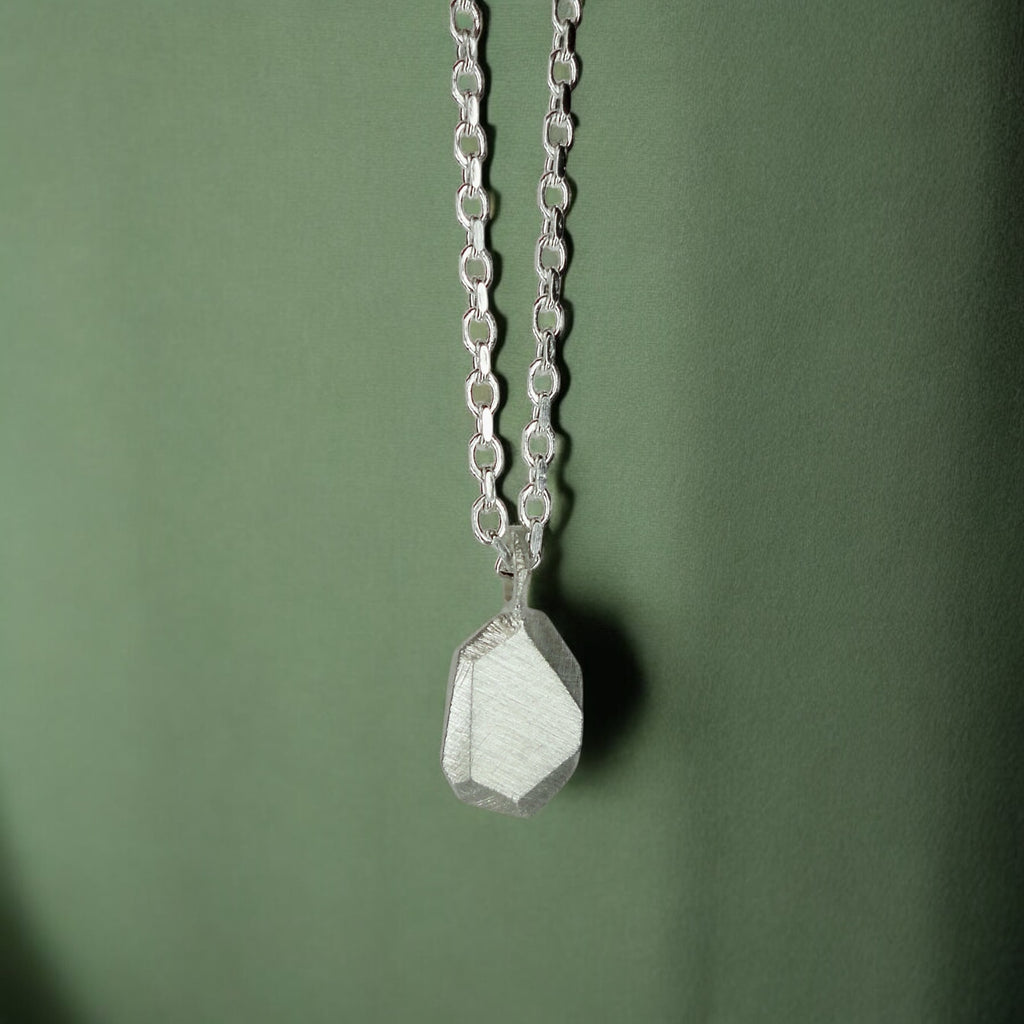 Custom-made engraved geometric initial pendant necklace in sterling silver