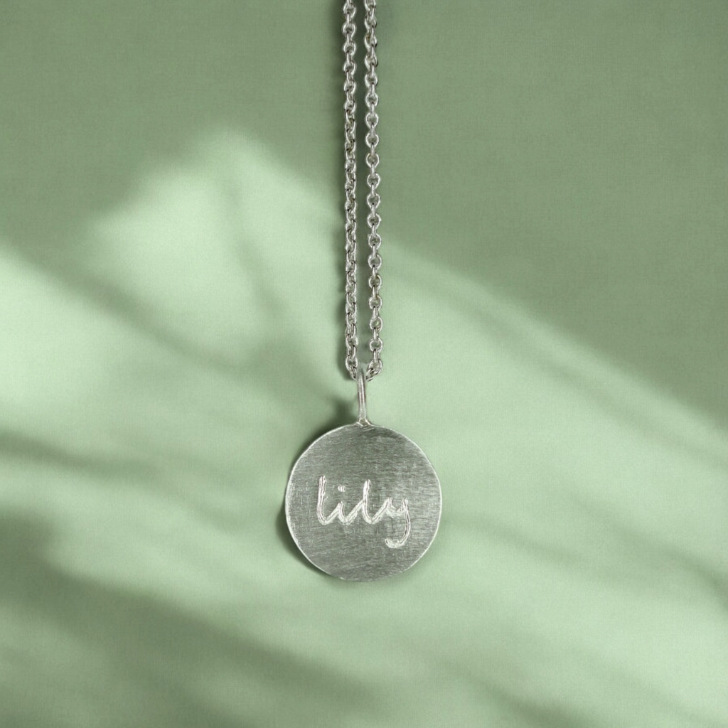 Custom engraved disc pendant necklace in sterling silver
