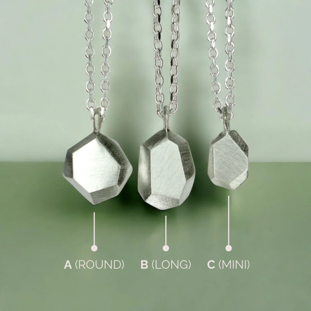 Custom-made engraved geometric initial pendant necklace in sterling silver