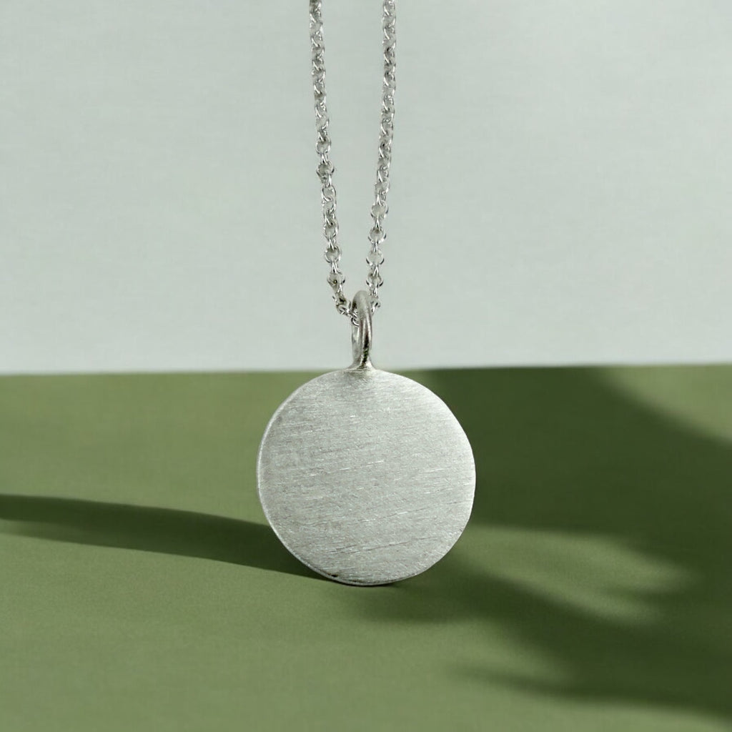 Custom engraved disc pendant necklace in sterling silver
