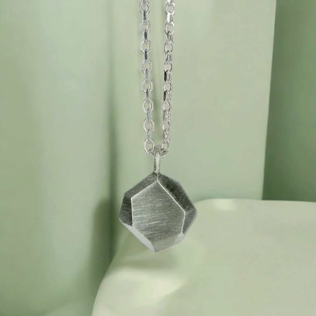 Custom-made engraved geometric initial pendant necklace in sterling silver