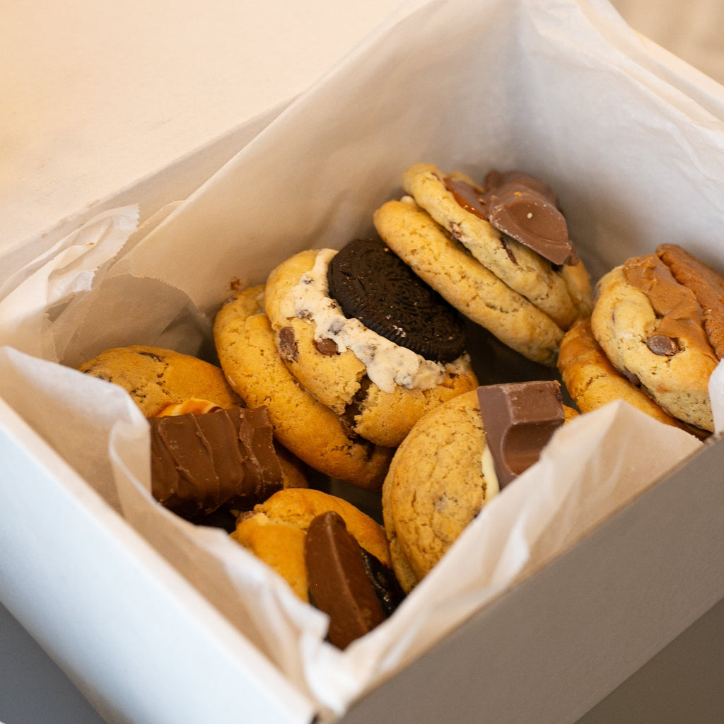 An open box of six cookies